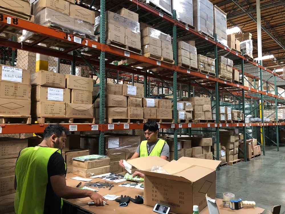 MPIO warehouse team picking and prepping orders from pallet racking